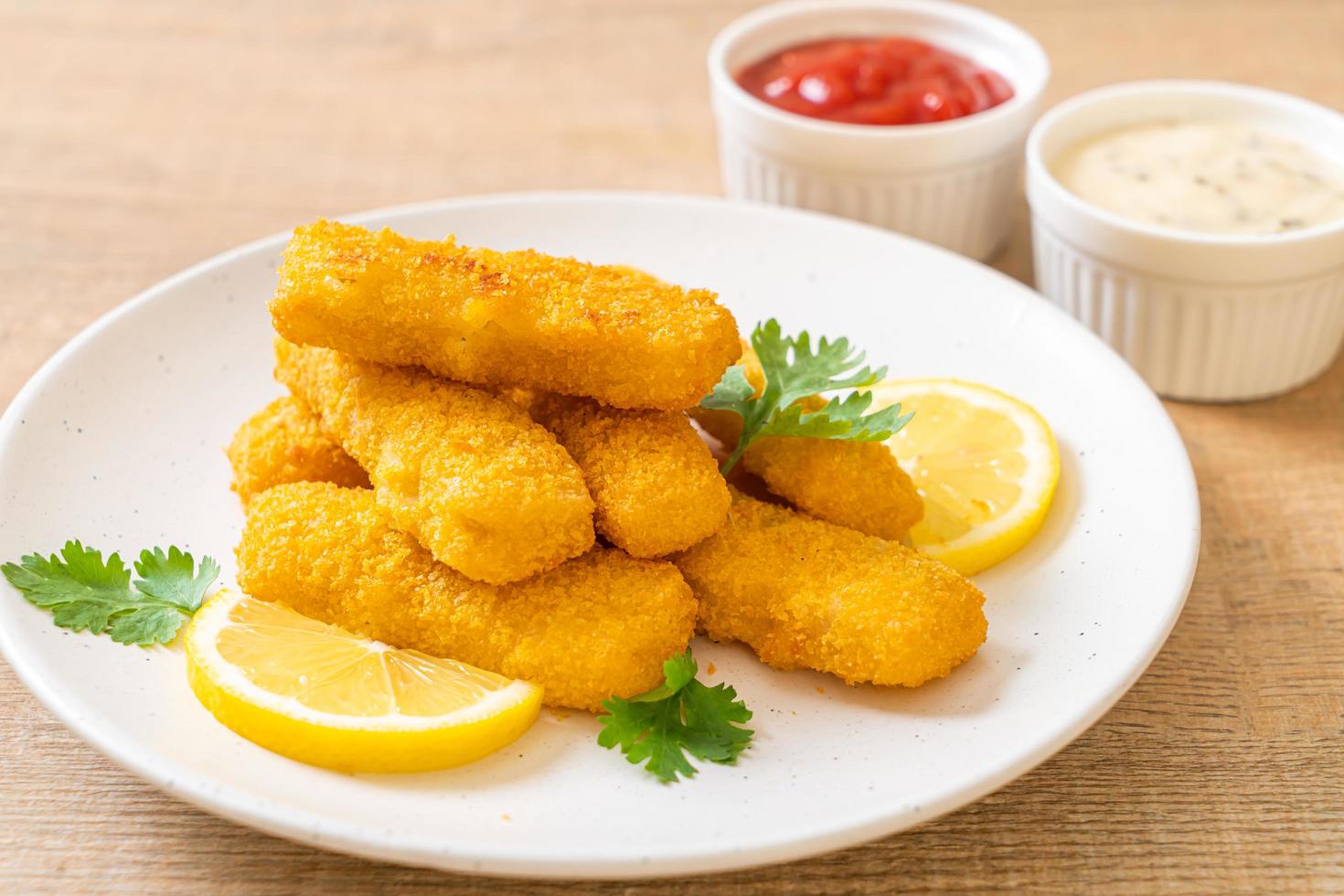 Fried fish finger sticks or french fries fish with sauce photo