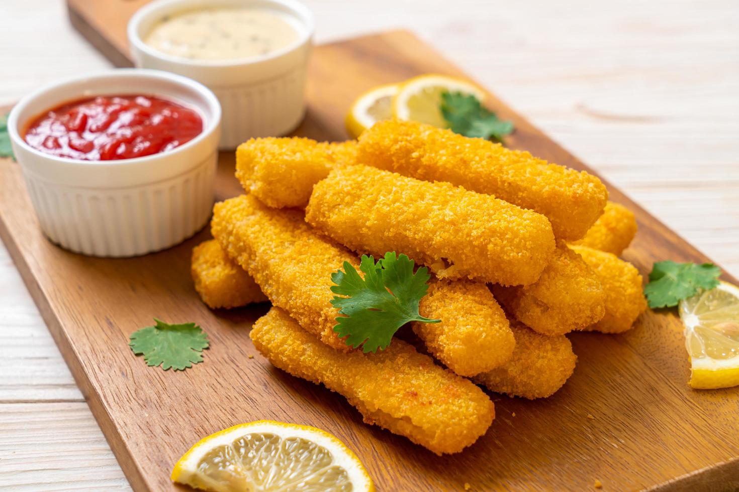 Fried fish finger sticks or french fries fish with sauce photo