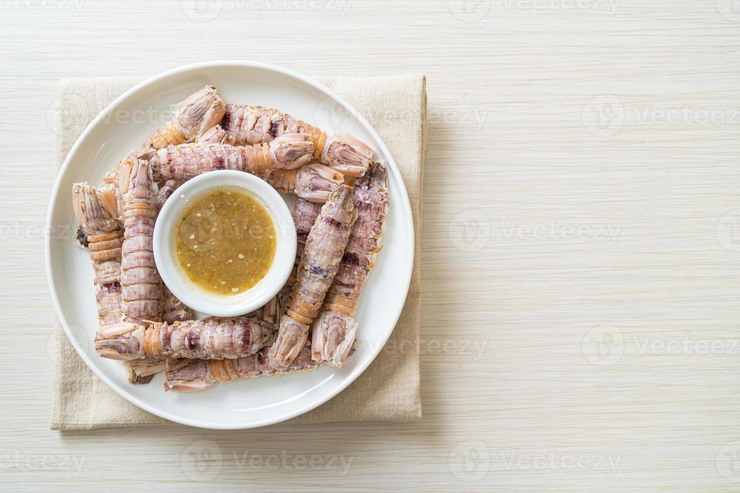 Steamed crayfish or mantis shrimps or stomatopods with spicy seafood sauce photo