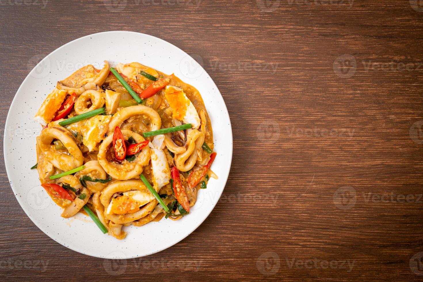 Stir-fried squid or octopus with salt egg - Asian food style photo