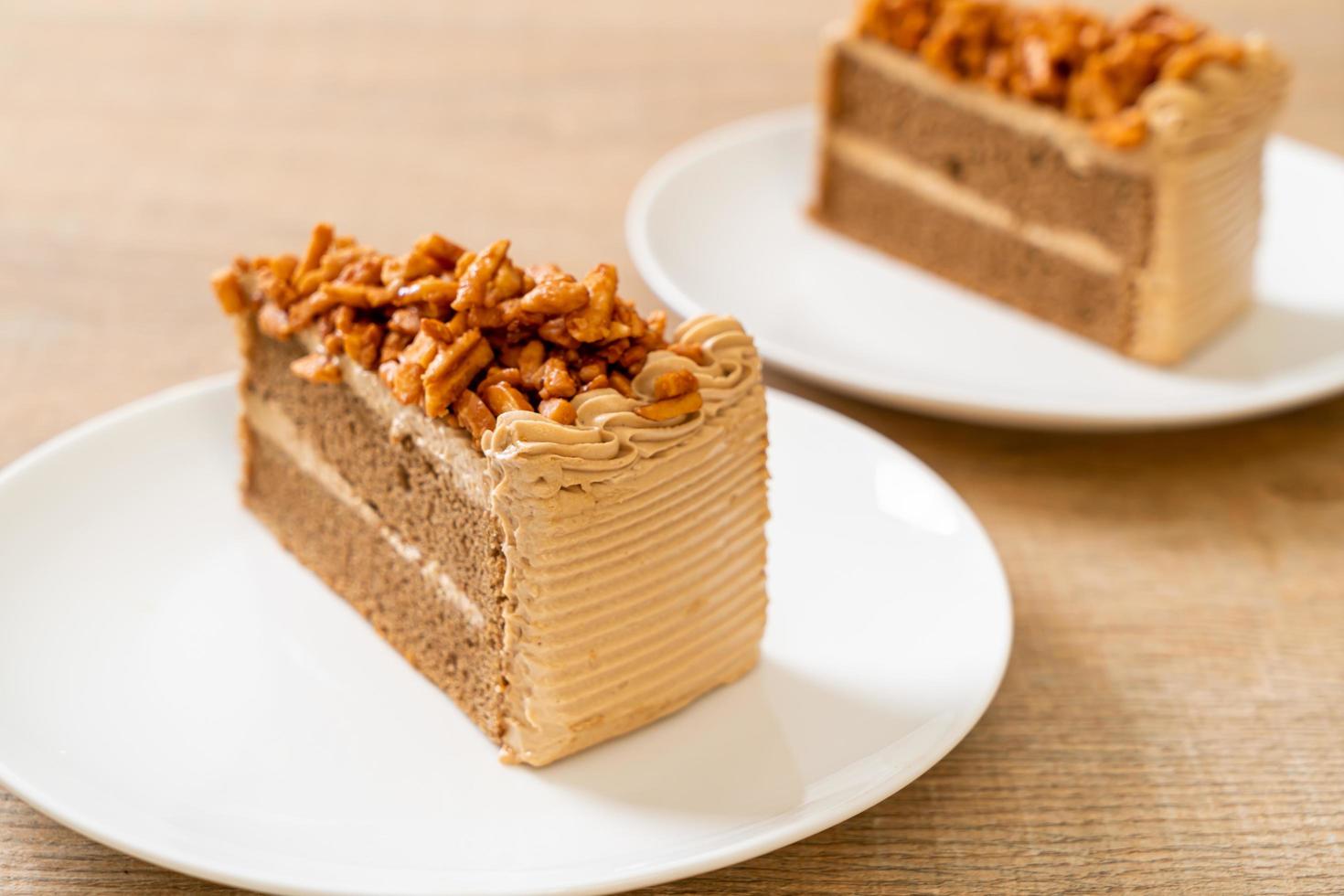 Homemade coffee almonds cake on white plate photo