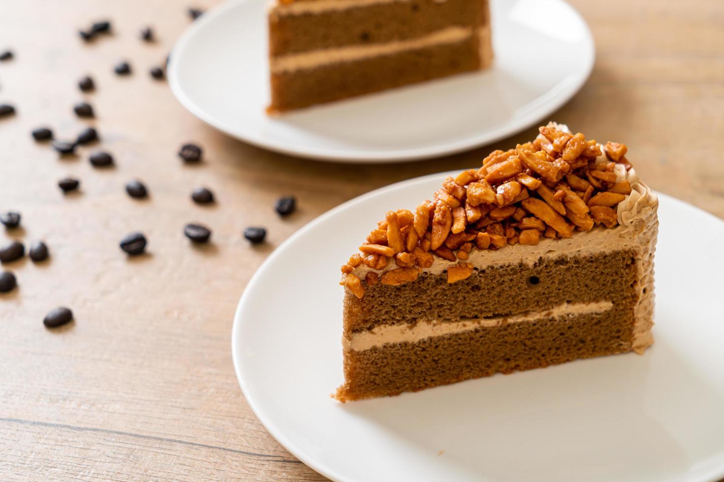 Homemade coffee almonds cake on white plate photo