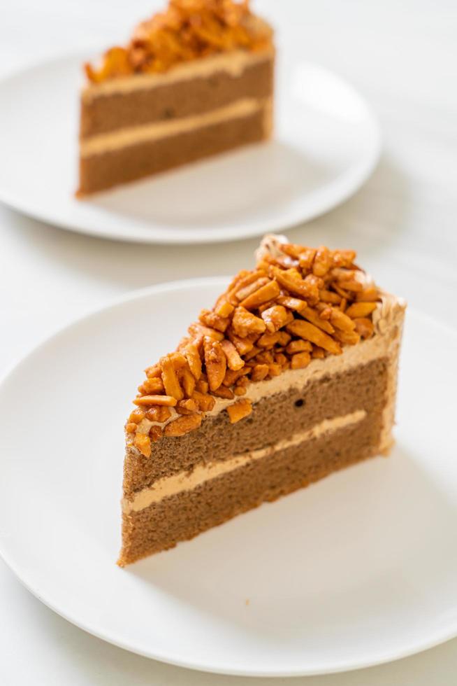 Homemade coffee almonds cake on white plate photo