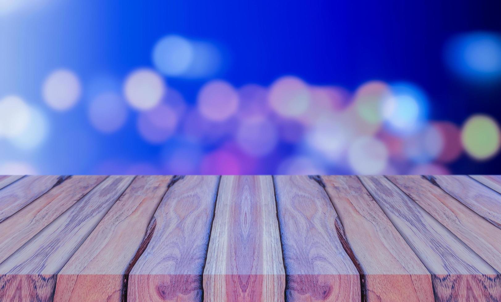 Natural wood planks on blue background abstract blur bokeh glitter for Christmas and New Year photo