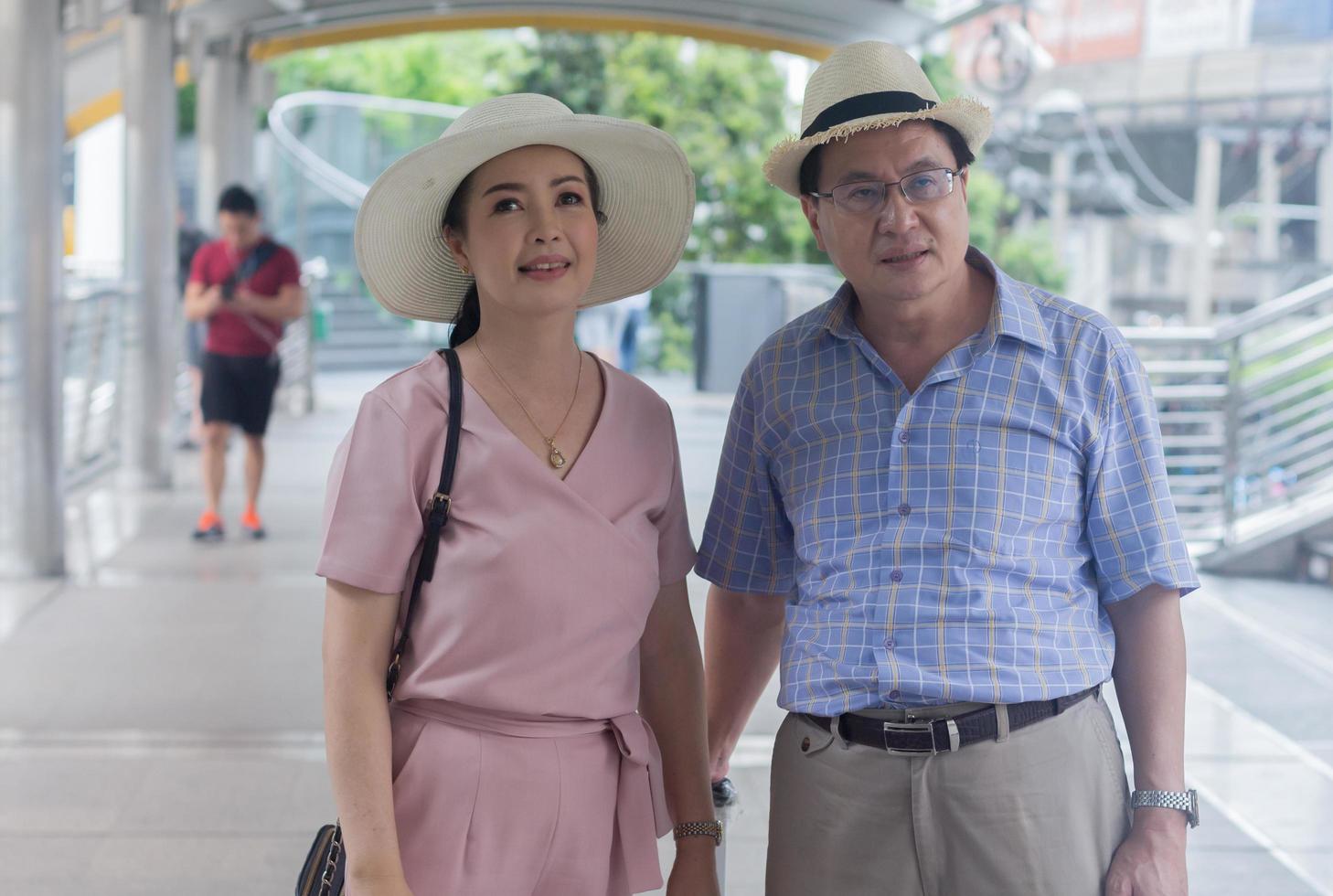 Elderly Asian couple is traveling Concept Holiday travel photo