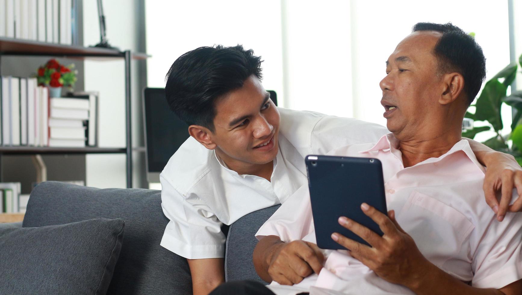 Happy father and son at home on vacation photo