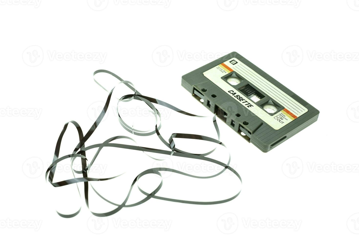 Vintage compact cassette tape on white background photo