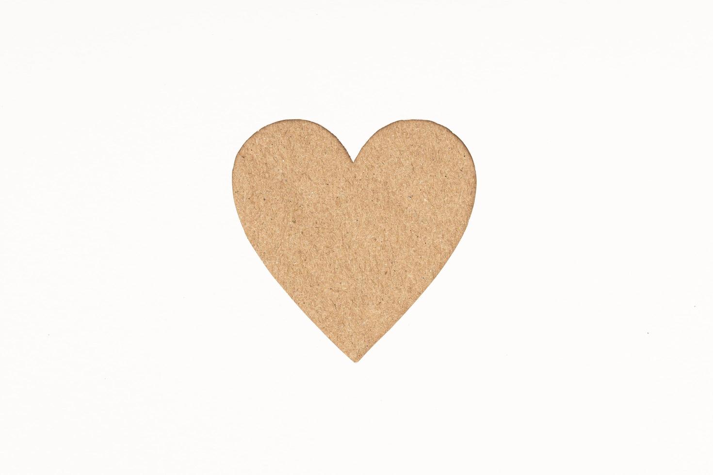 Die-cut Cardboard Heart shaped isolated on white paper background. Love concept photo