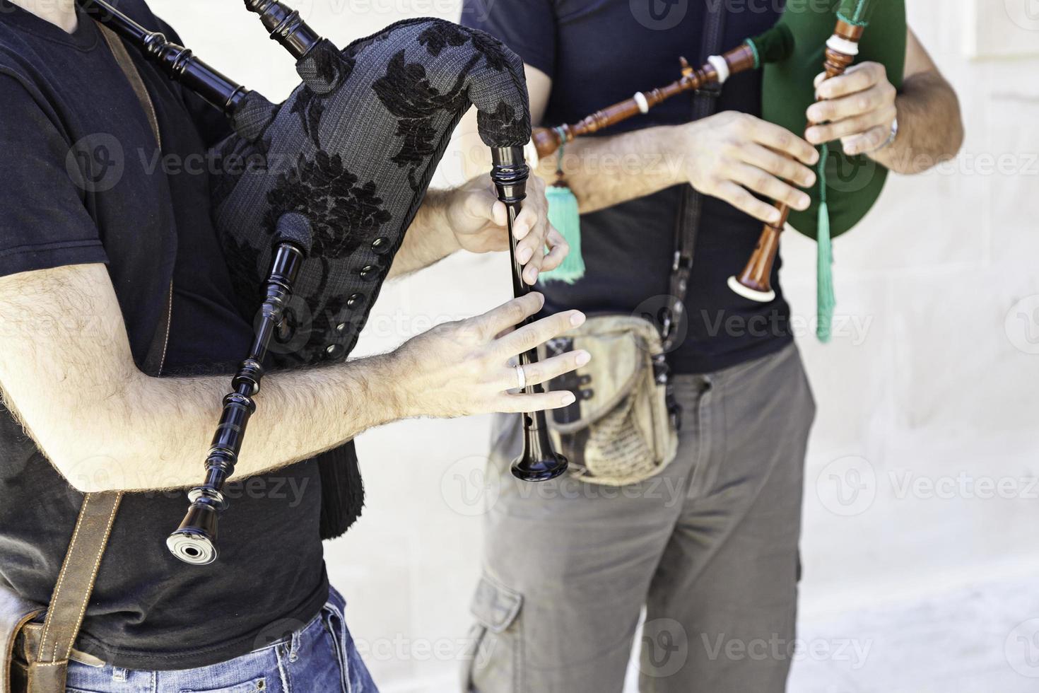 Pipers playing the bagpipes photo