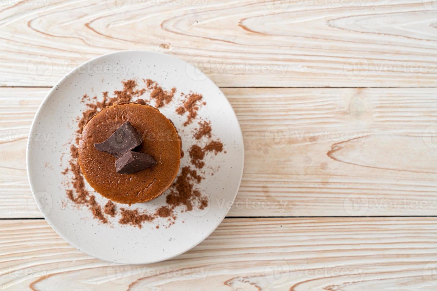 Chocolate pancake stack with chocolate powder photo