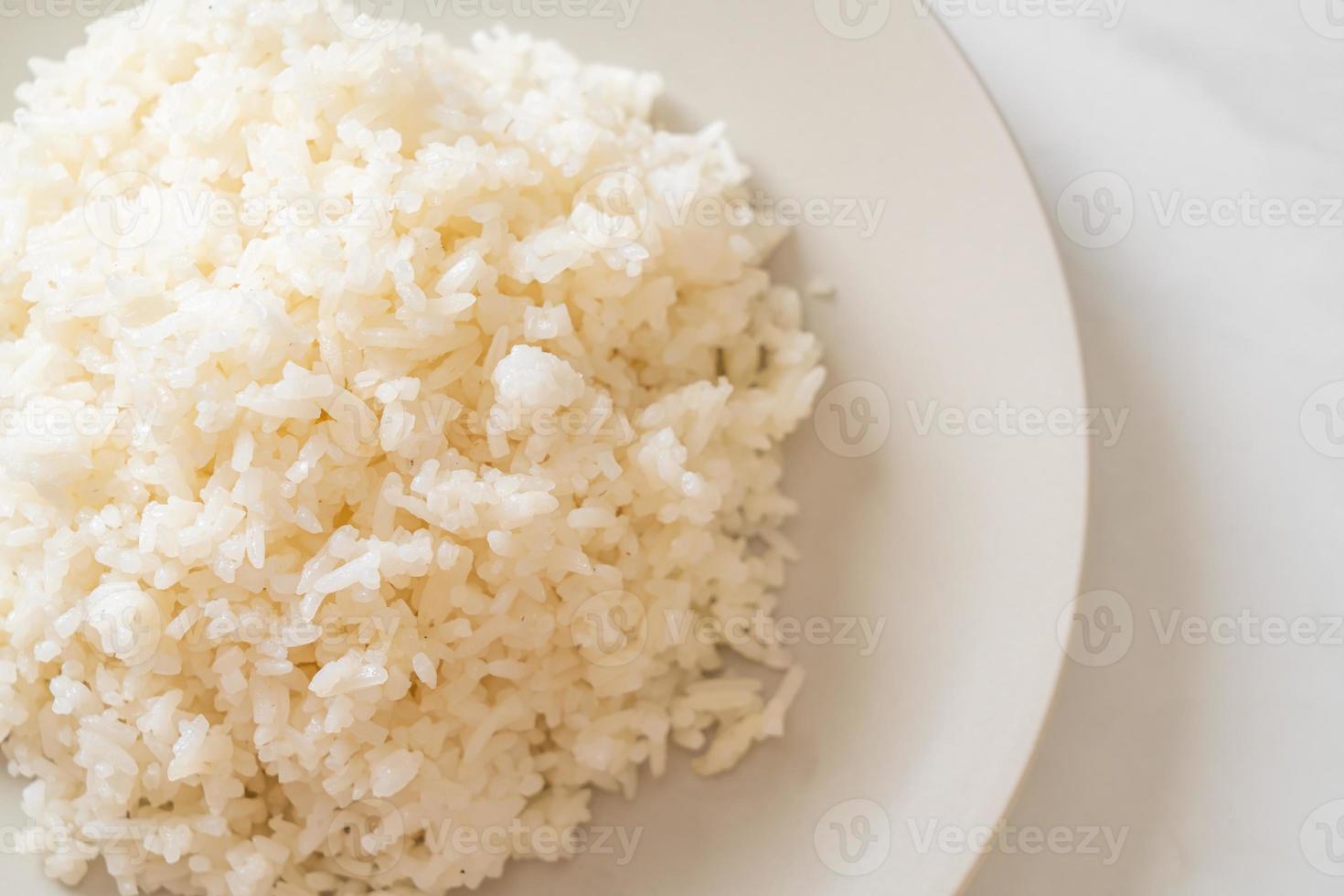 Cooked Thai jasmine white rice on plate photo