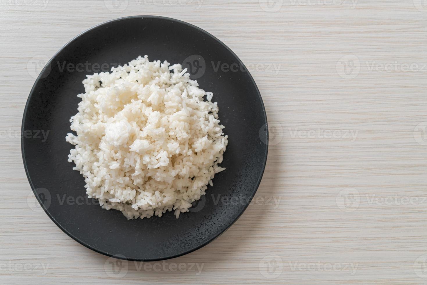 Cooked Thai jasmine white rice on plate photo