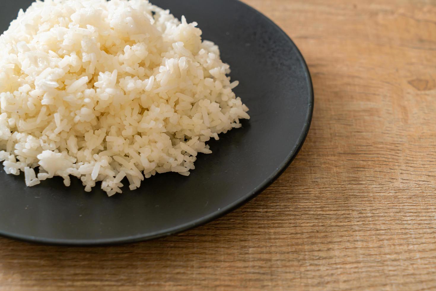 Cooked Thai jasmine white rice on plate photo