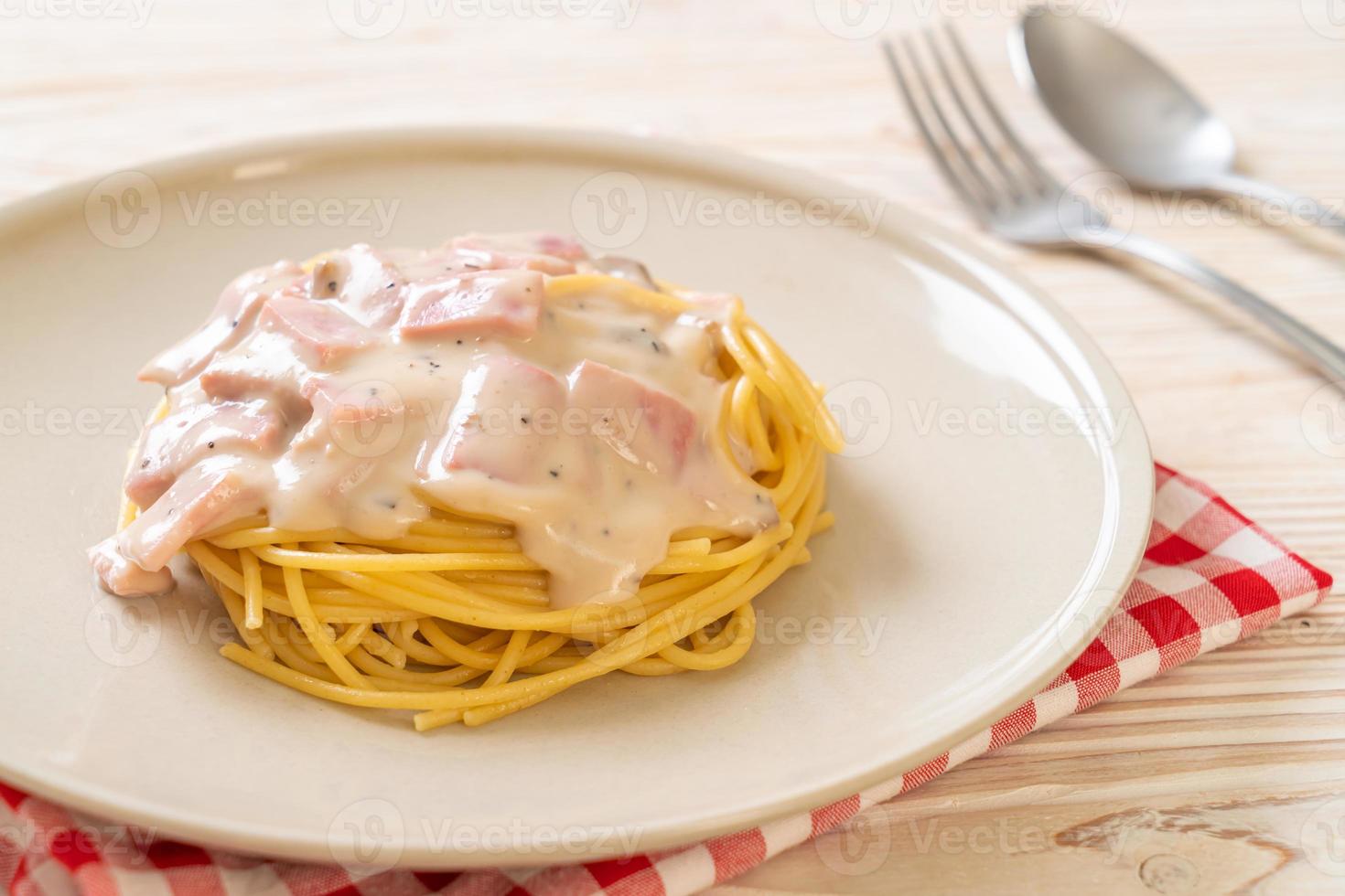 Homemade spaghetti white cream sauce with ham - Italian food style photo
