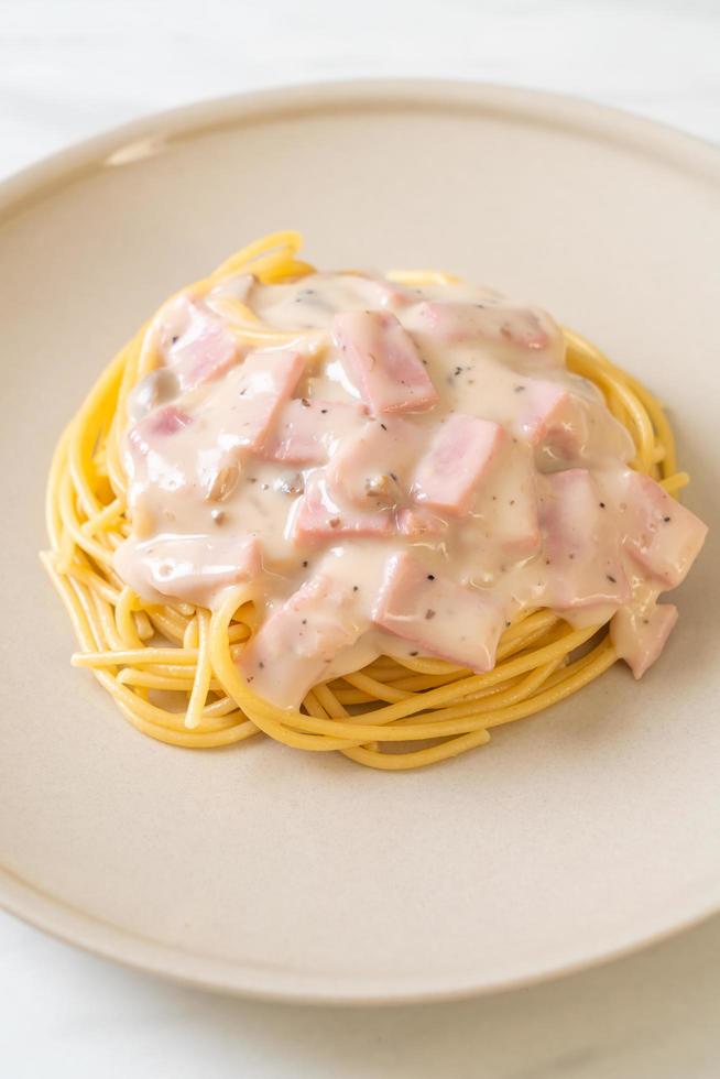 Homemade spaghetti white cream sauce with ham - Italian food style photo