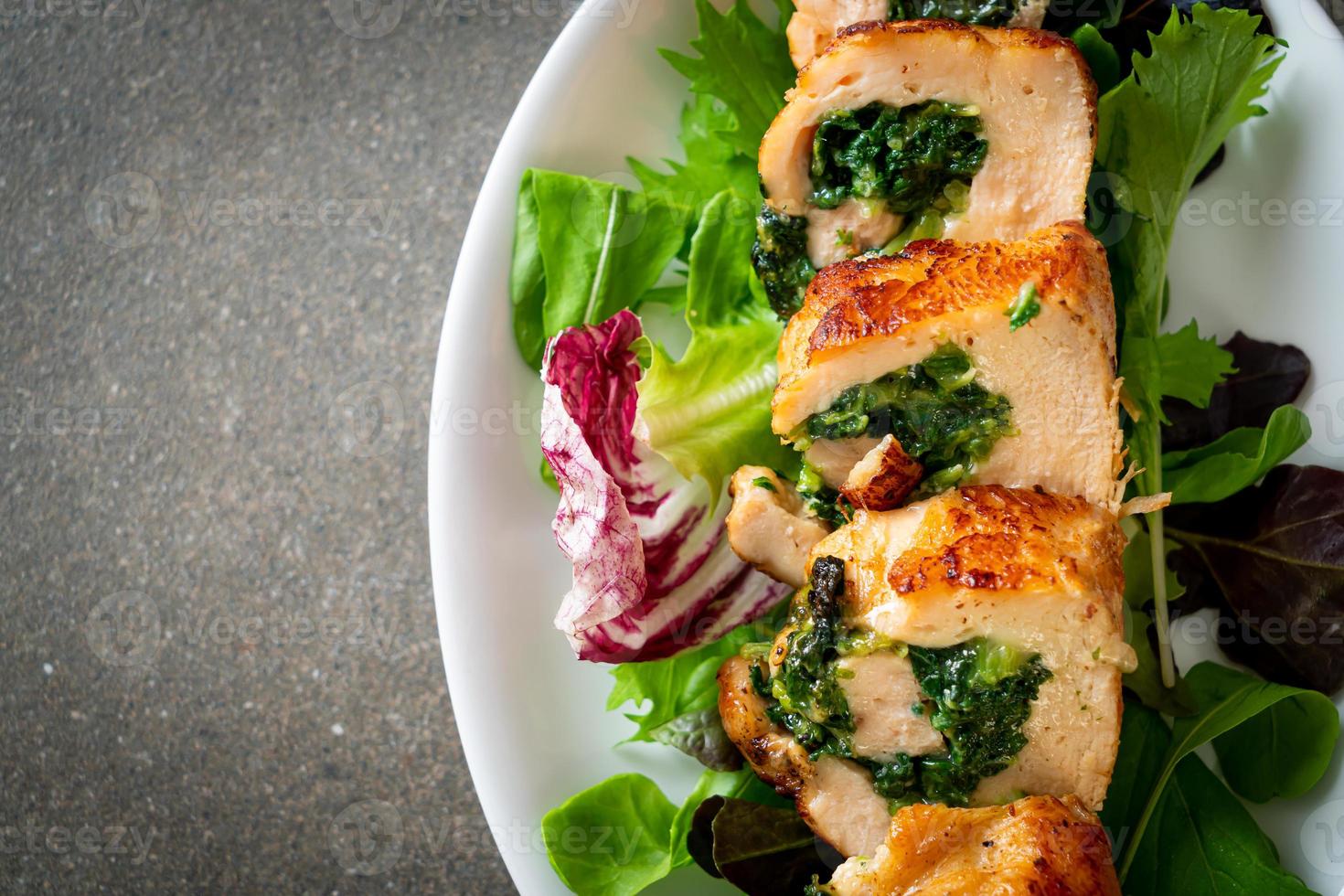 Baked chicken breast stuffed with cheese and spinach photo