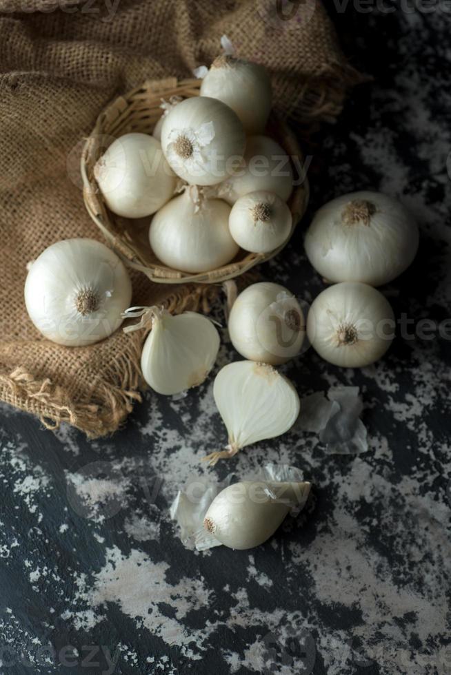 Onions on textured background. Food Ingredients. photo