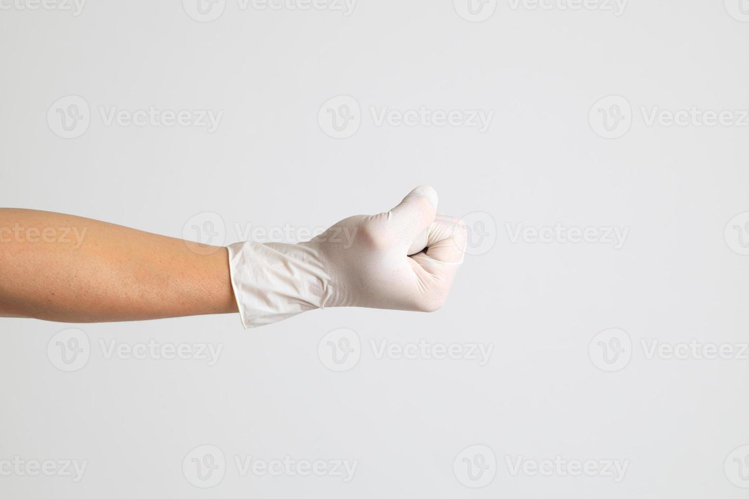 mano con guantes médicos foto