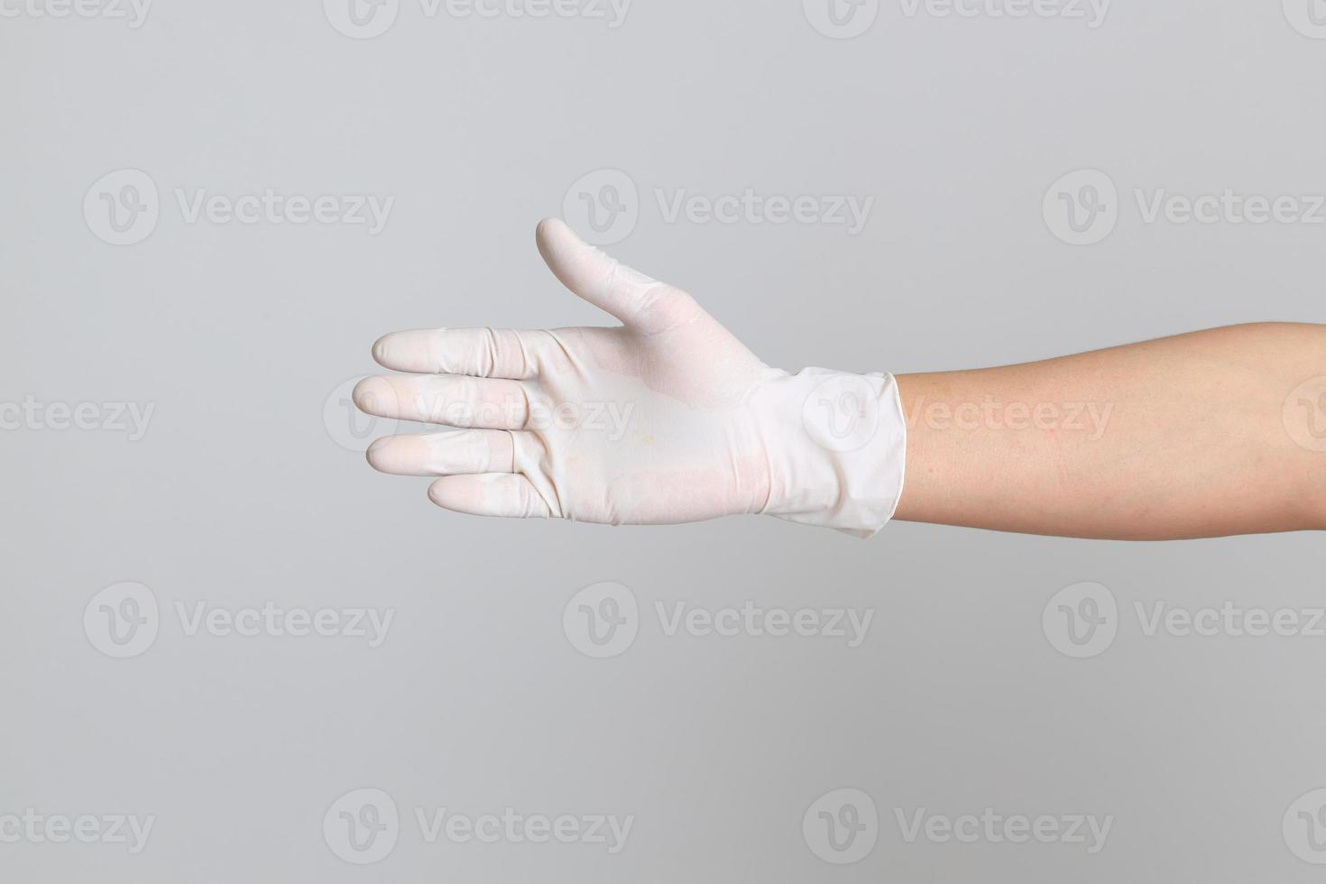 mano con guantes médicos foto