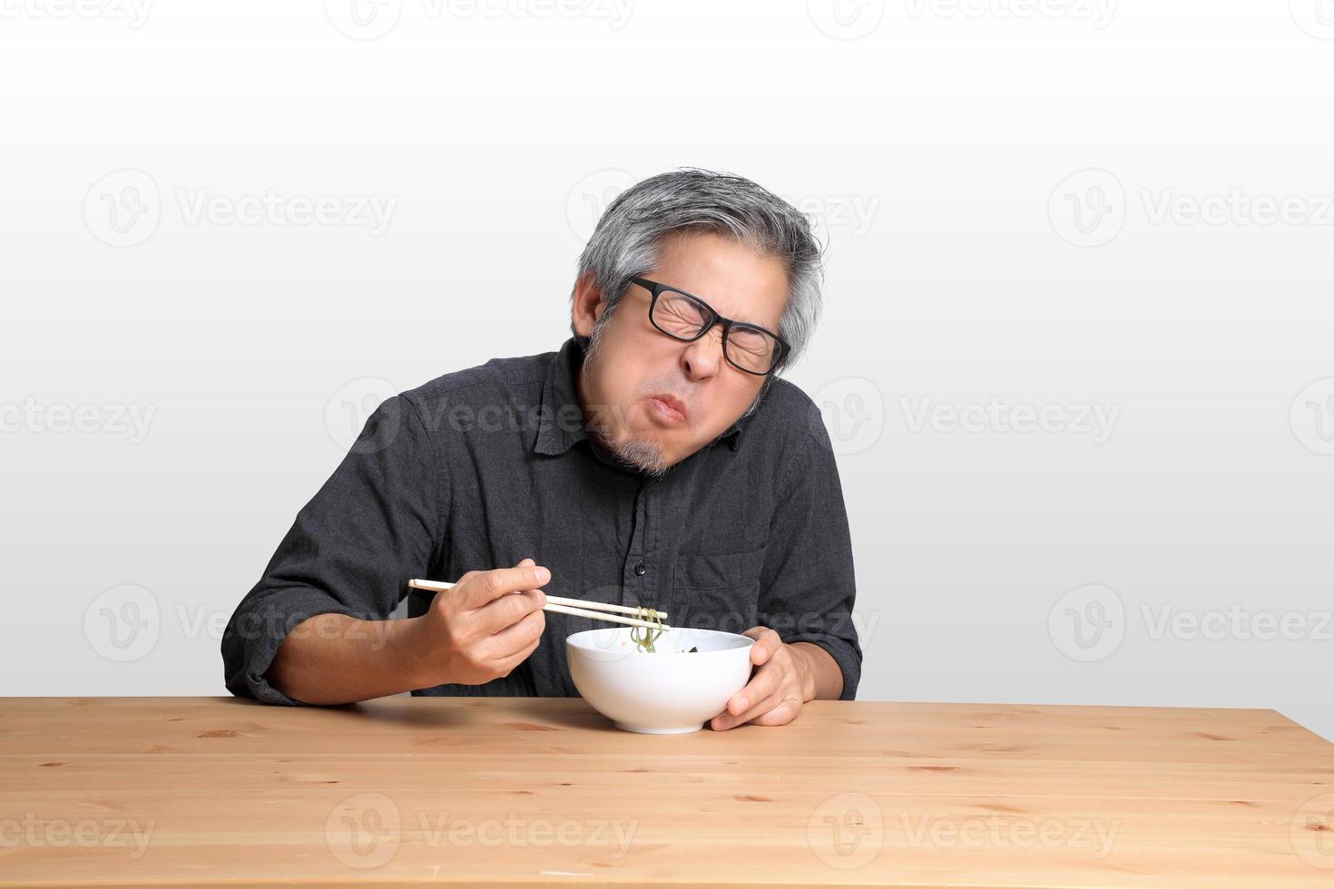 Asian Man Sitting photo