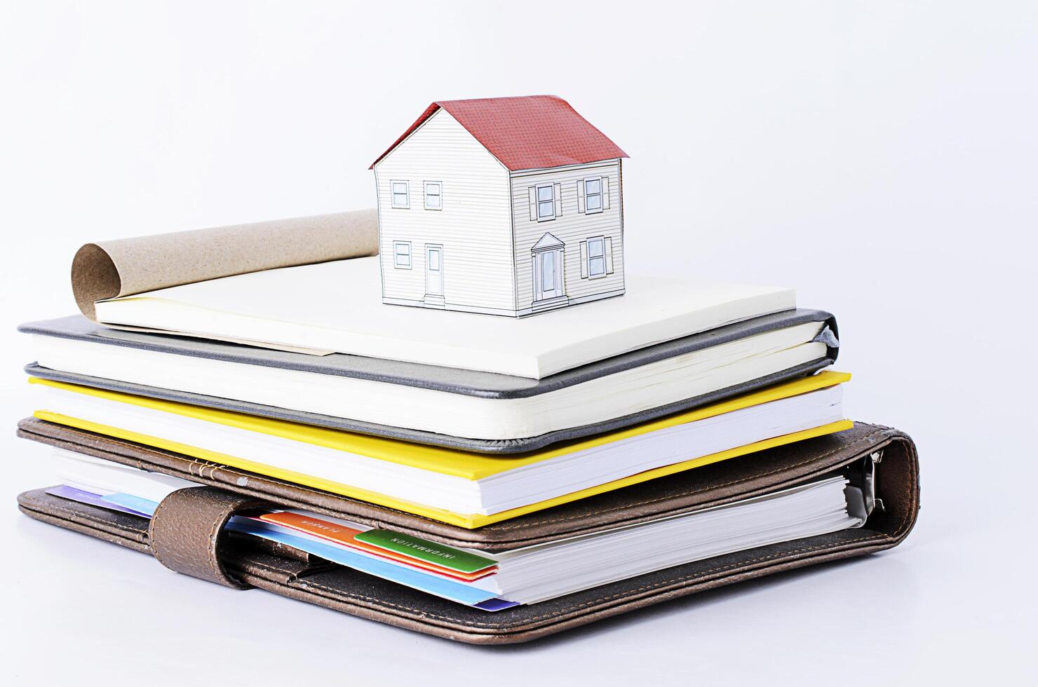 Paper house on Books stack photo