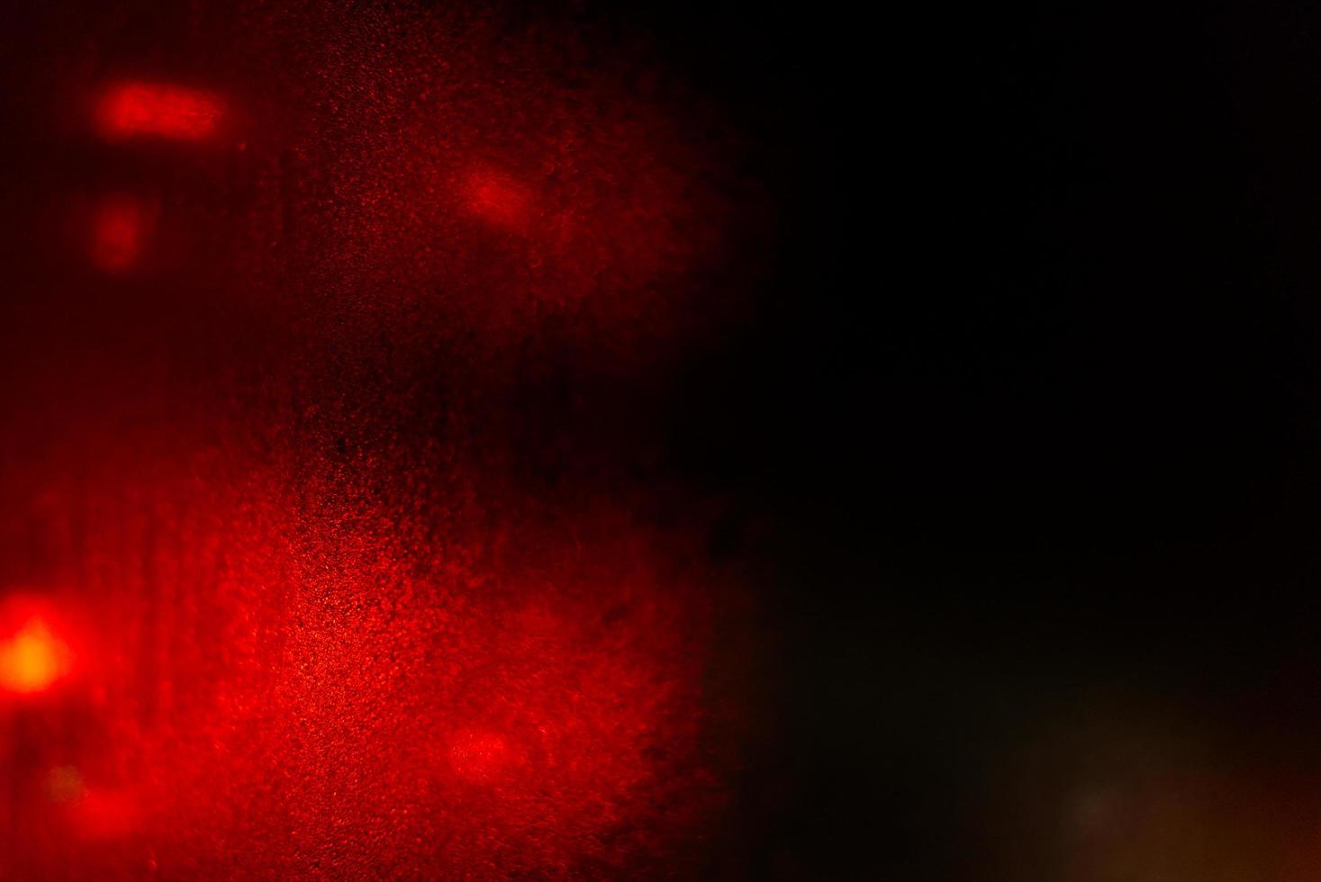 Red bokeh light at the window photo