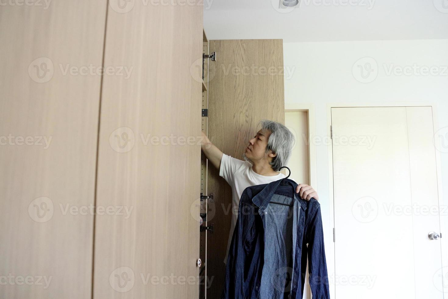 Asian Man with Wardrobe photo