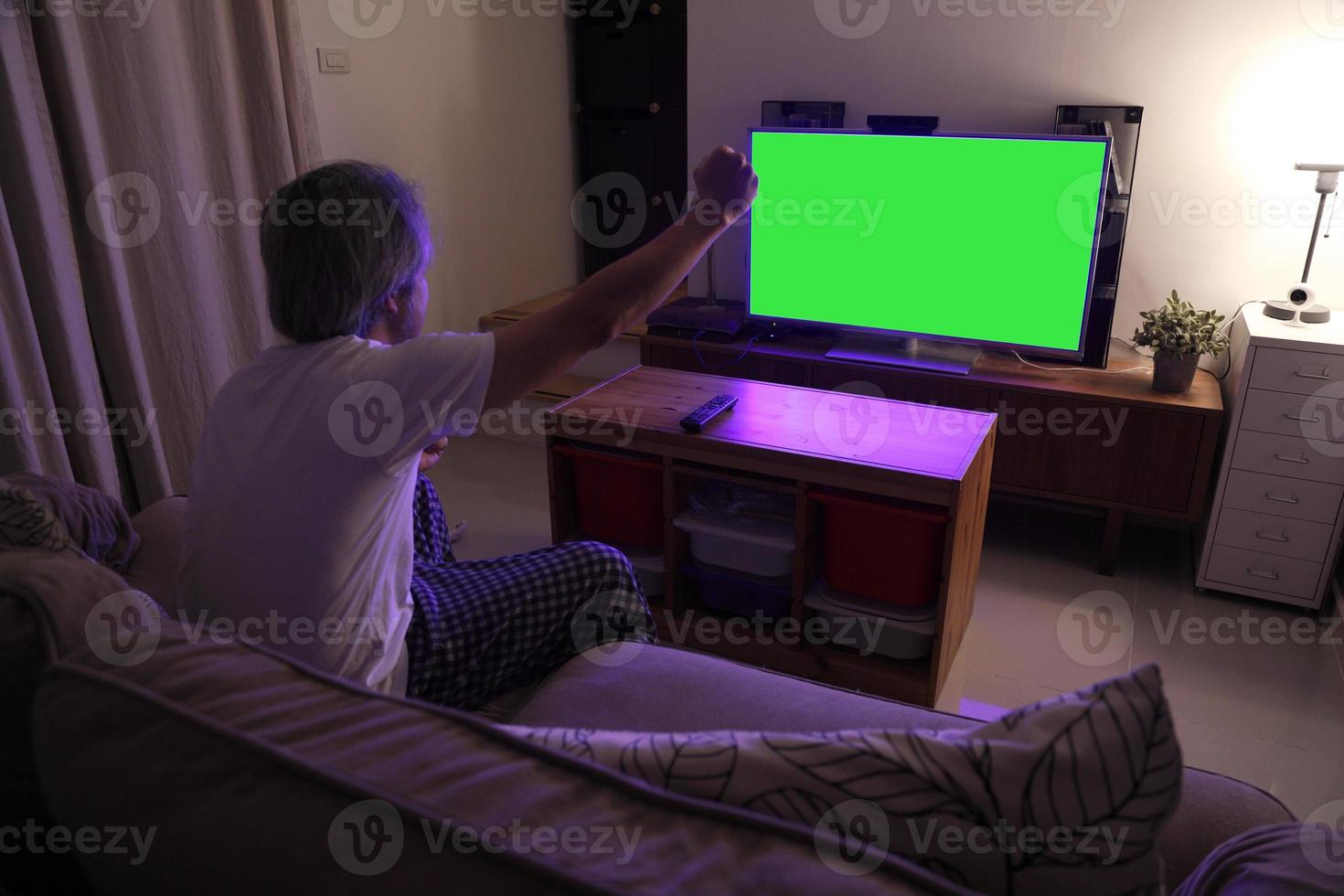 Asian Man Watching Television photo