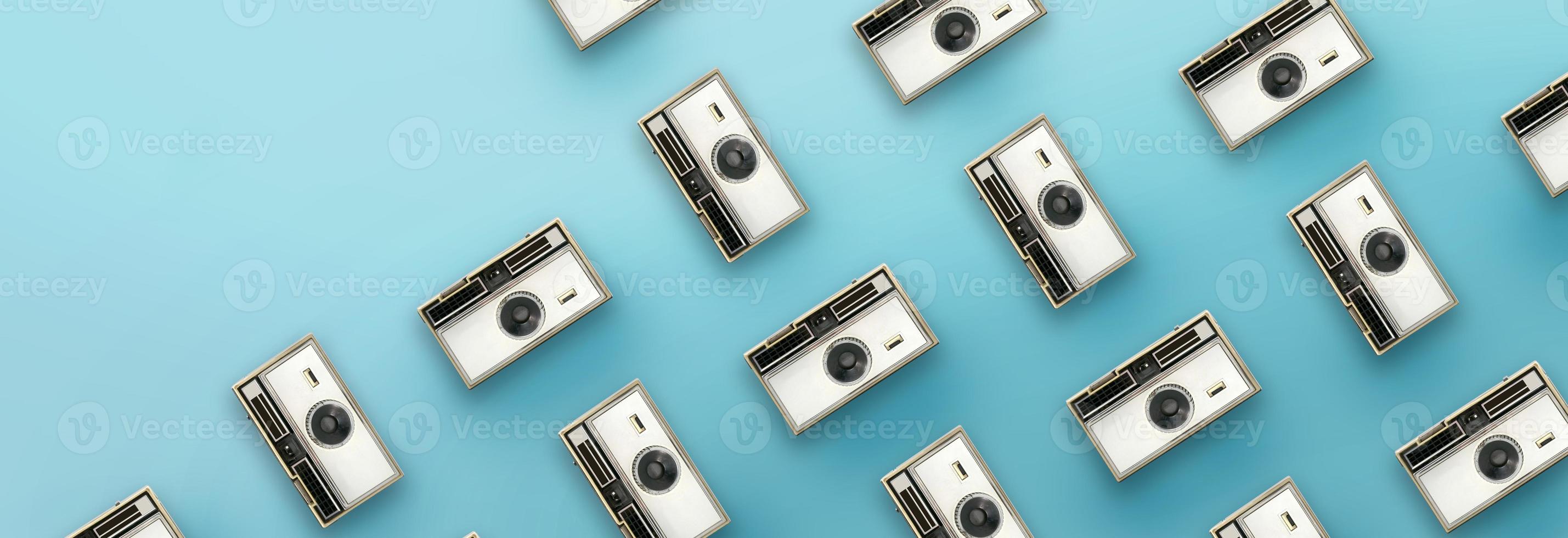 Vintage camera pattern on blue background. photo