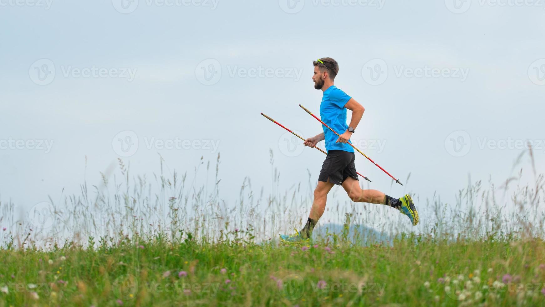 Mountain runner during the preparation of a long distance trail photo