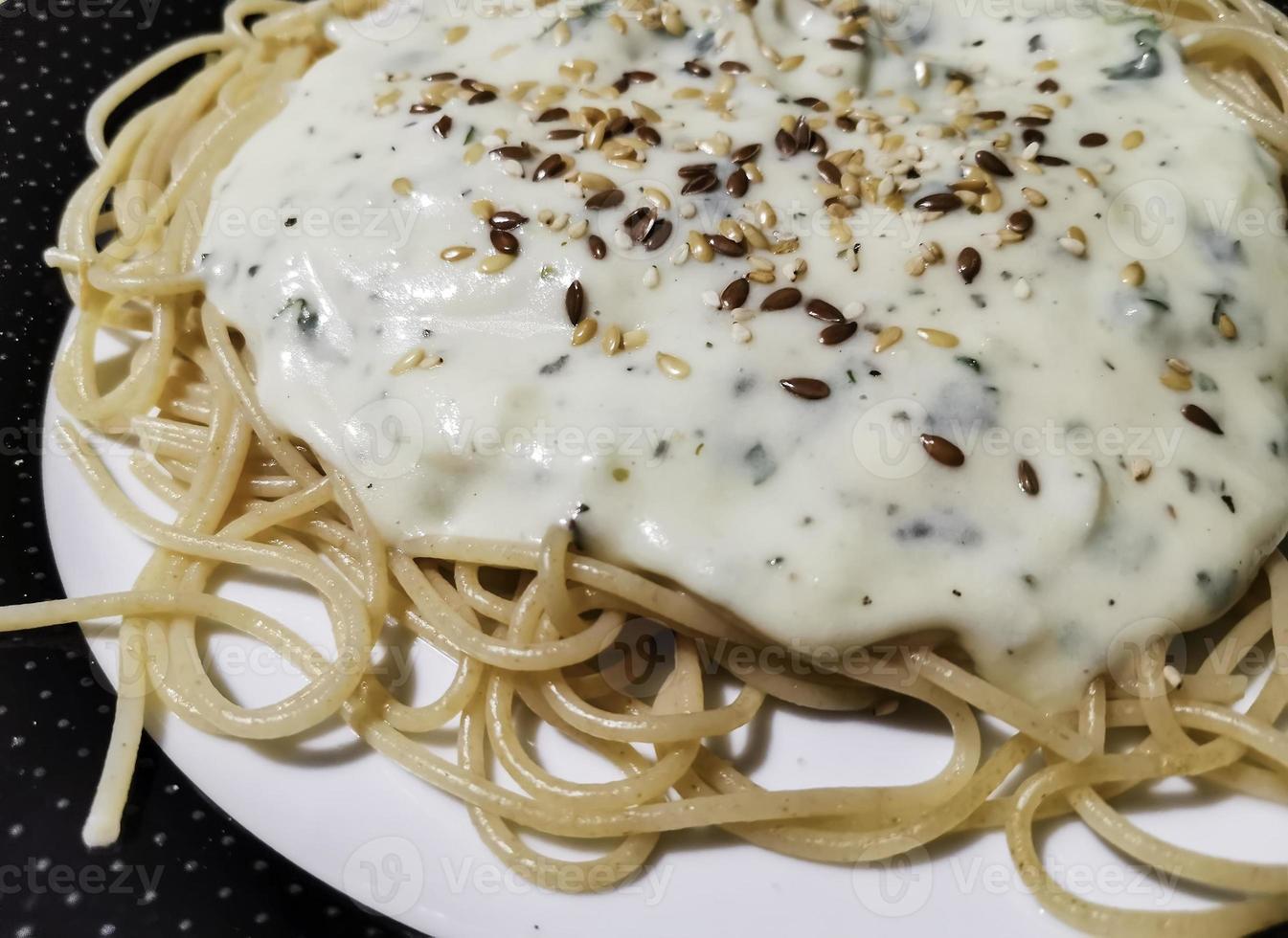 Spaghetti with cheese sauce photo