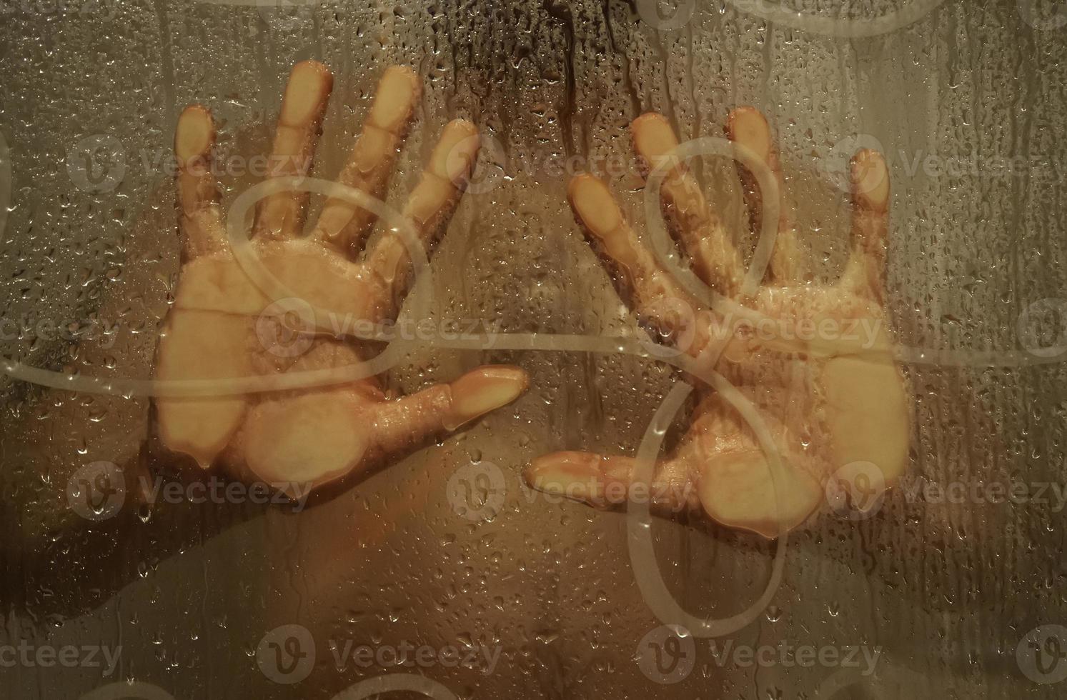 Hand on shower screen photo