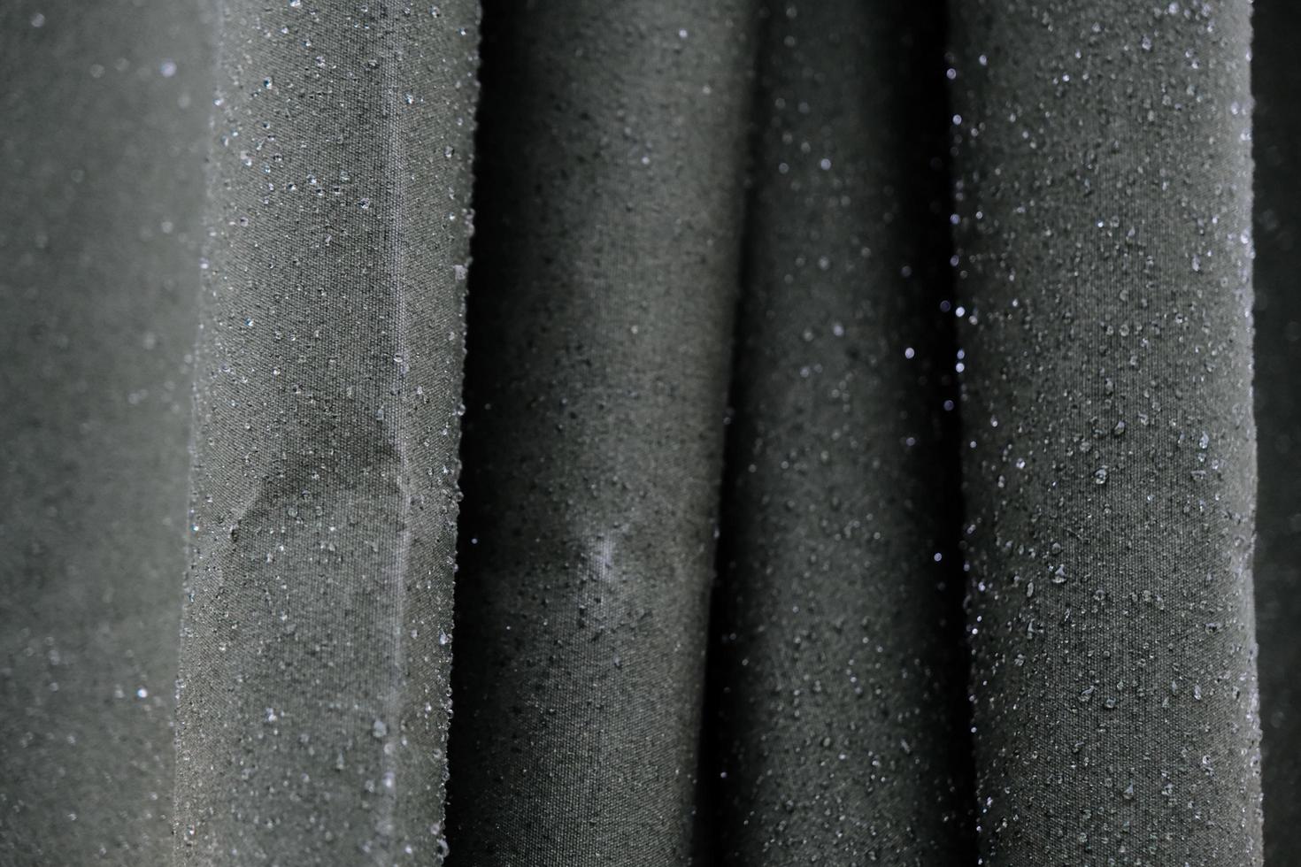 Wet umbrella made of smooth and tight gray waterproof fabric photo