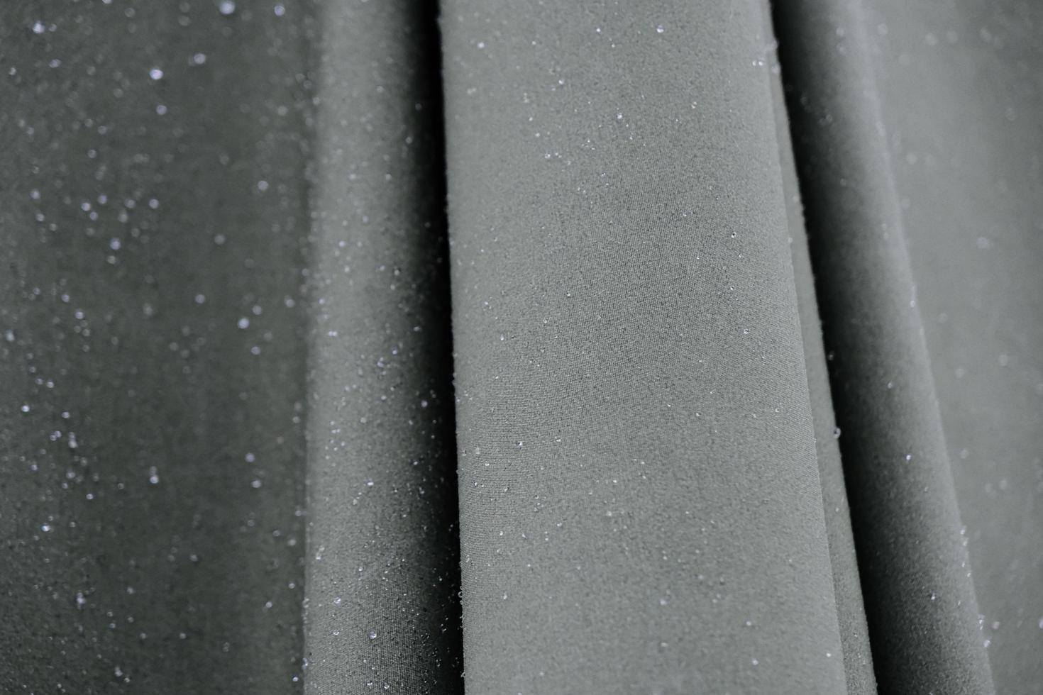Wet umbrella made of smooth and tight gray waterproof fabric photo