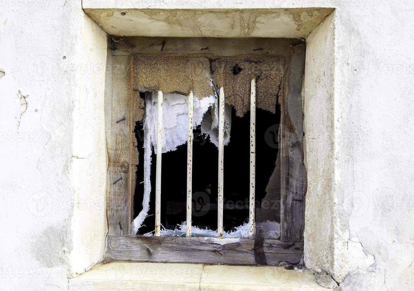 Window with rusty bars photo