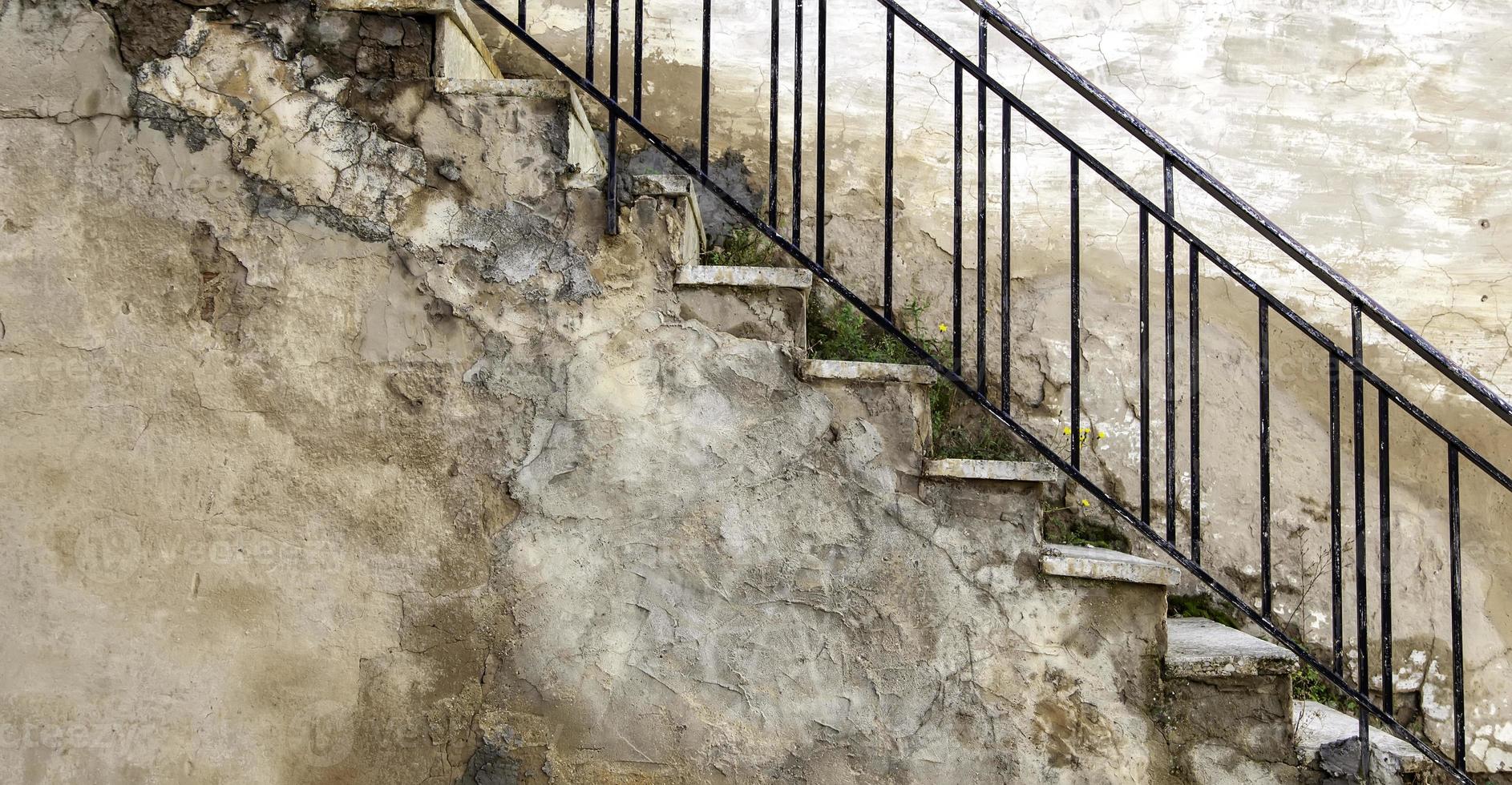 Stone stairs with handrails photo