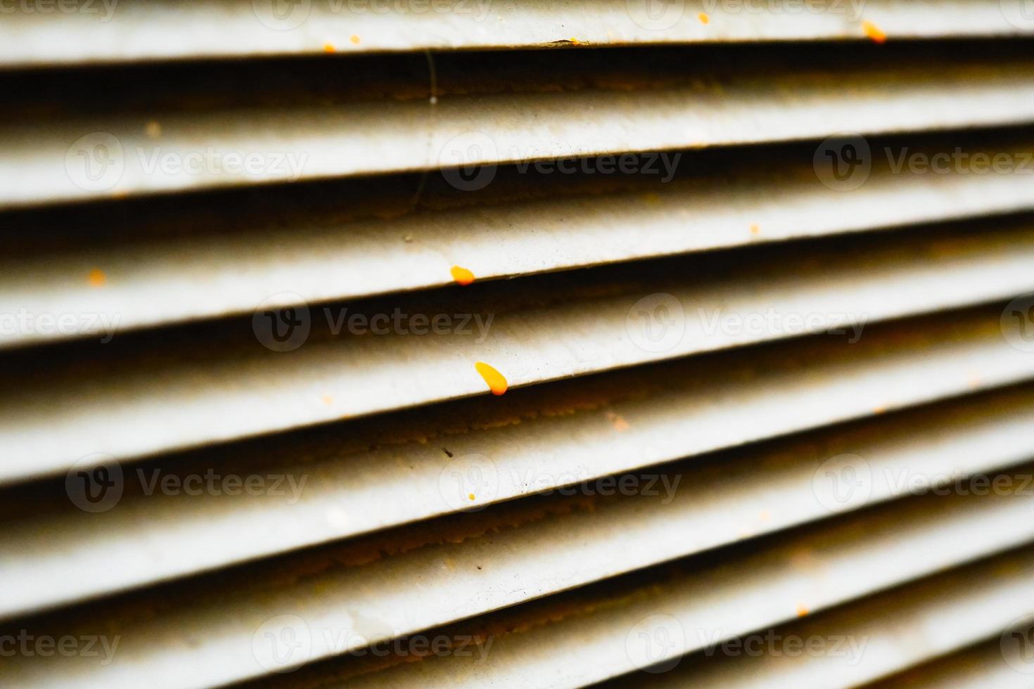Dirty stained metallic jalousie pattern close-up photo