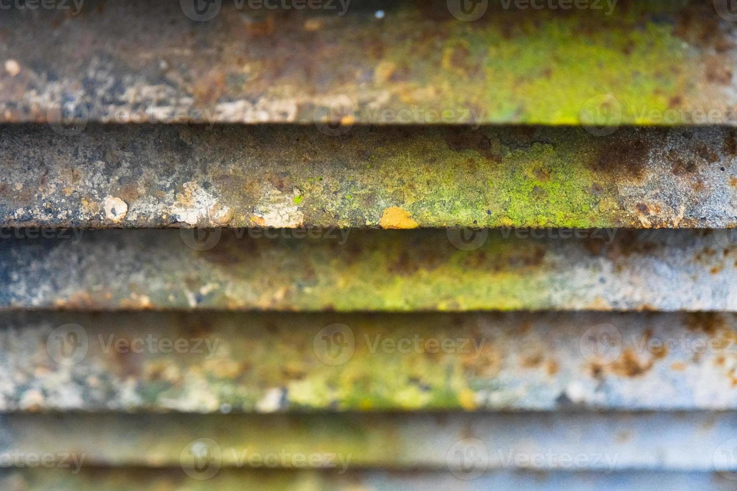 Close-up of rusty metal lattice wall photo