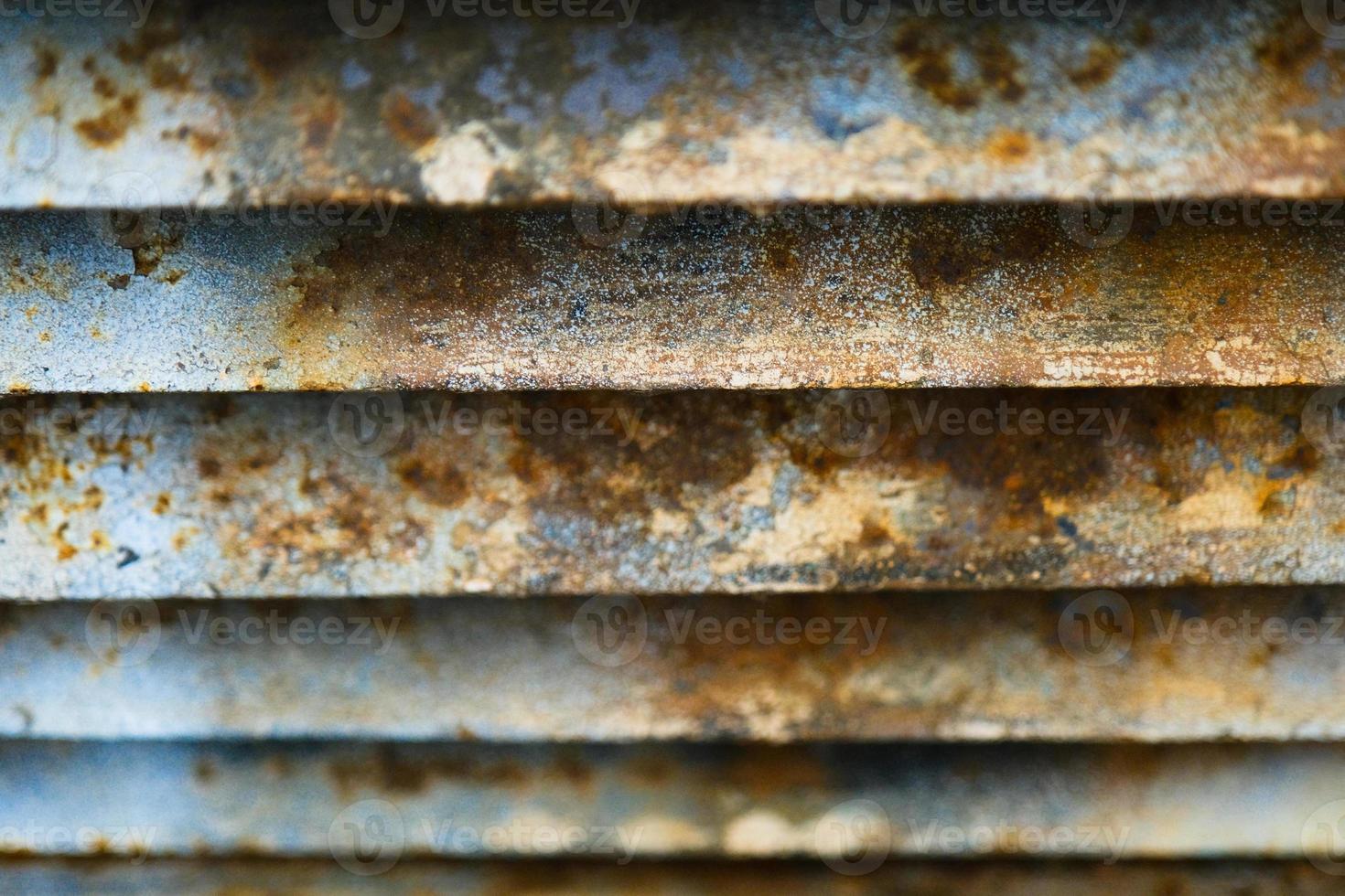 Close-up of rusty metal lattice wall photo