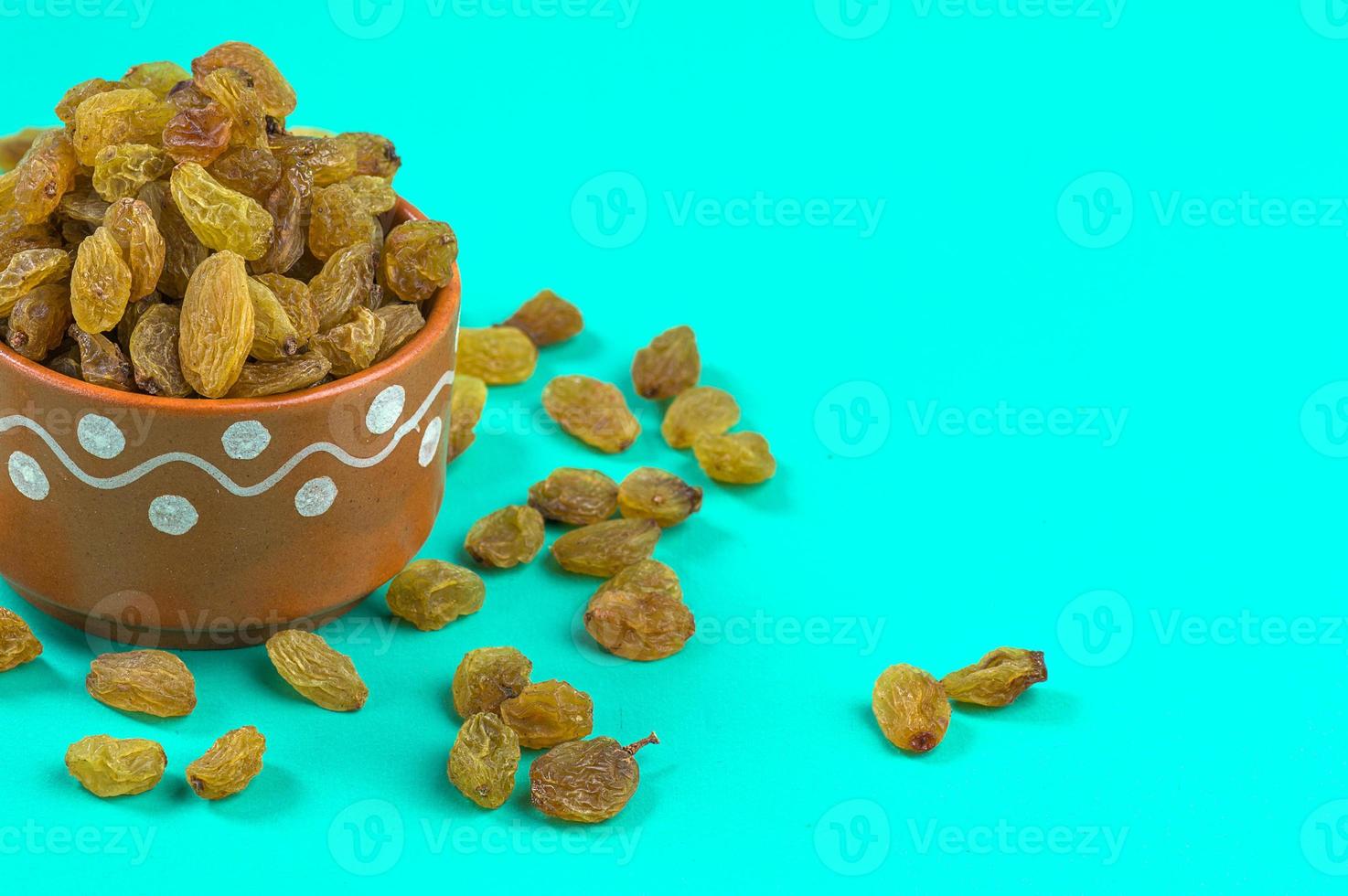 Dried Raisins in a clay Bowl photo