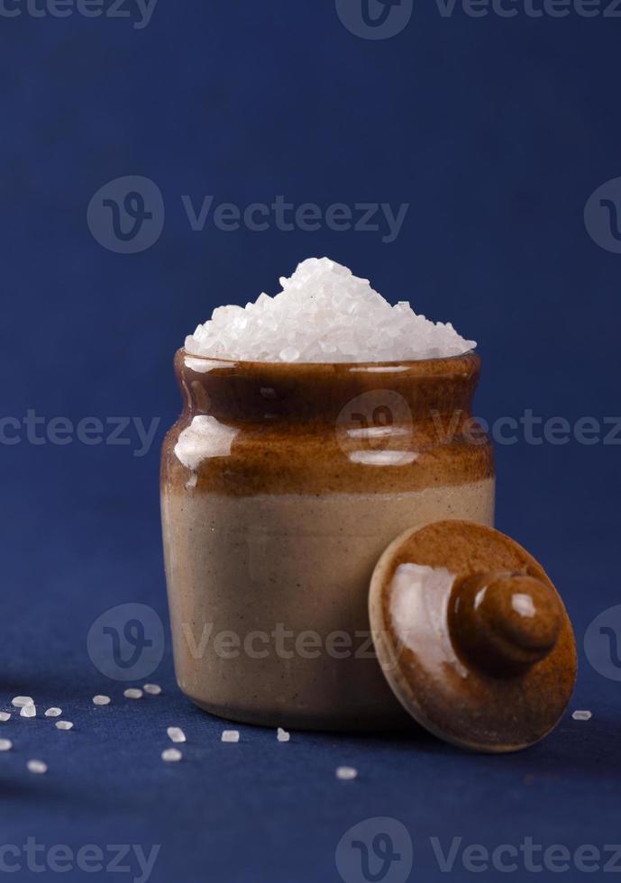 Sugar. white granulated sugar and refined sugar on a blue background photo