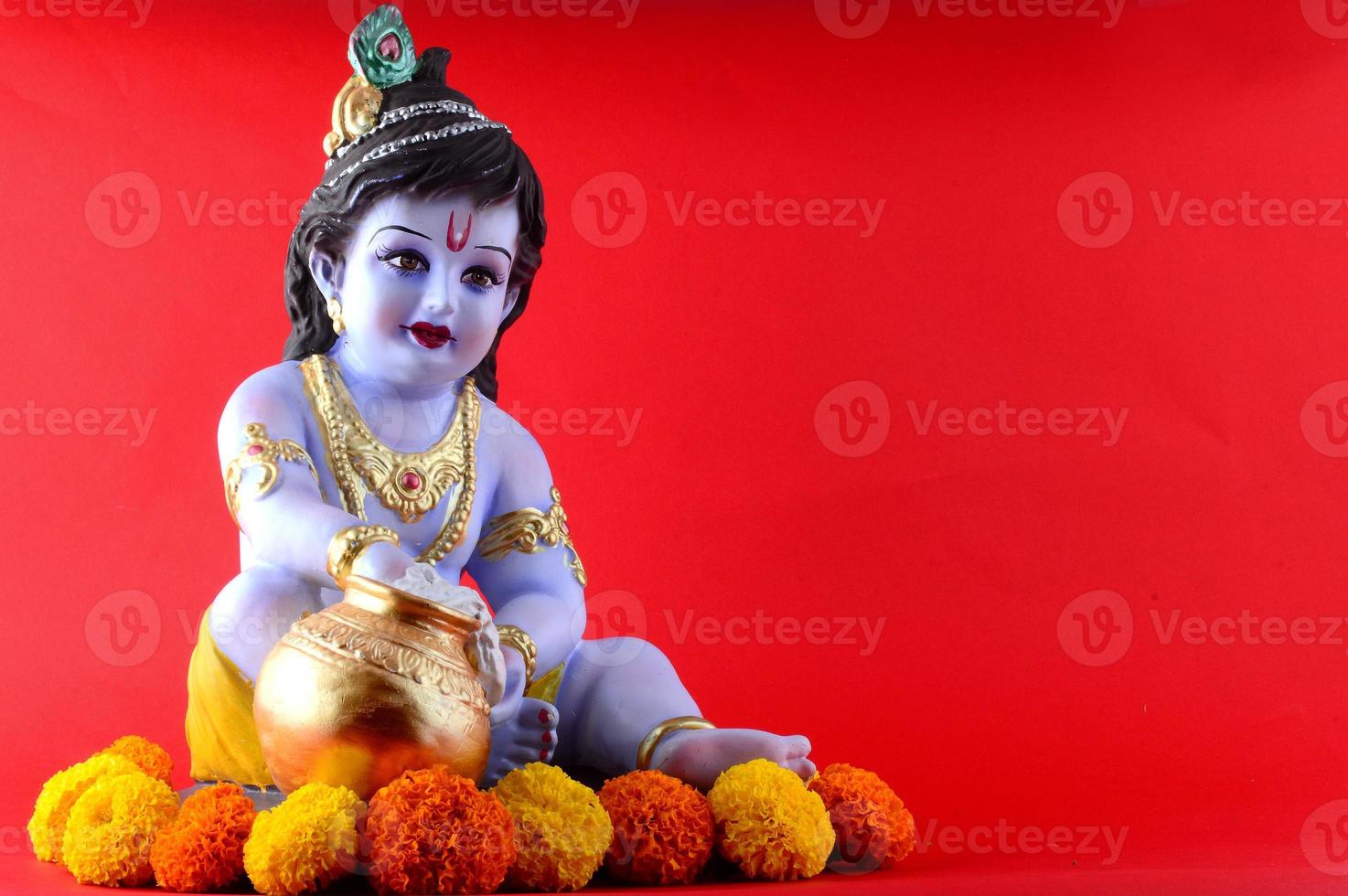 Hindu God Krishna on red background photo