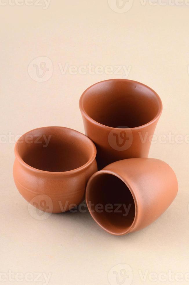 Close-up of Clay pots on cream color background photo