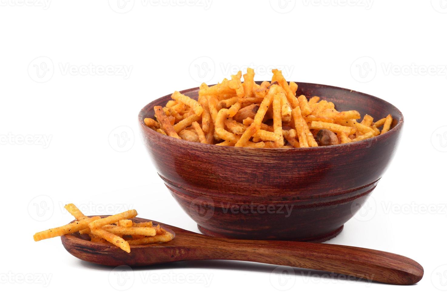 Deep fried salty dish - chivda or mixture made of gram flour and mixed with dry fruits. photo