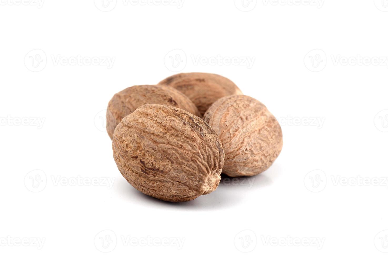 Nutmeg isolated on white background. Close up. photo