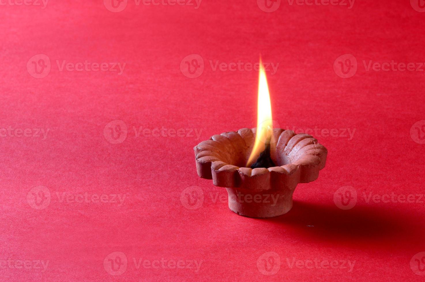 Clay diya lamps lit during diwali celebration. Greetings Card Design Indian Hindu Light Festival called Diwali photo