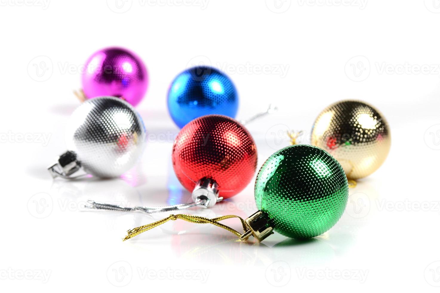 Christmas balls with ornaments on white background. photo