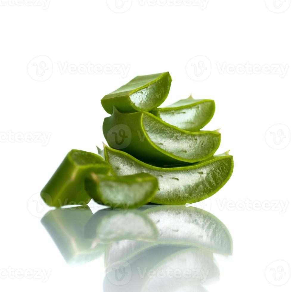 Slices of Aloe Vera leaves on a white background. Aloe Vera is a very useful herbal medicine for skincare and hair care. photo