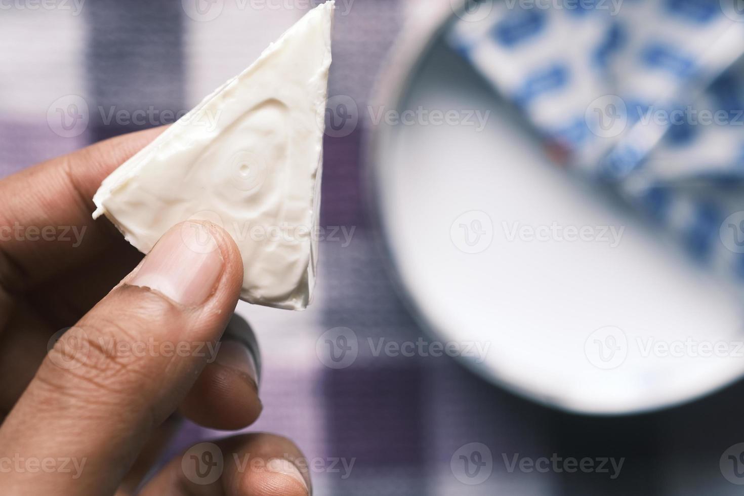 close up of holding fresh cheese photo