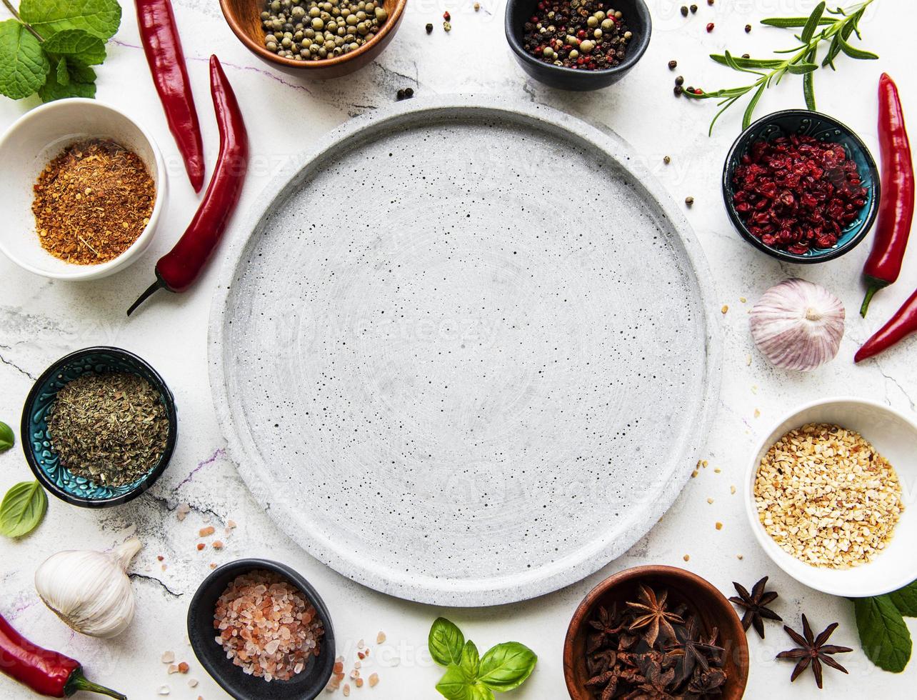 Empty plate and frame of spices photo